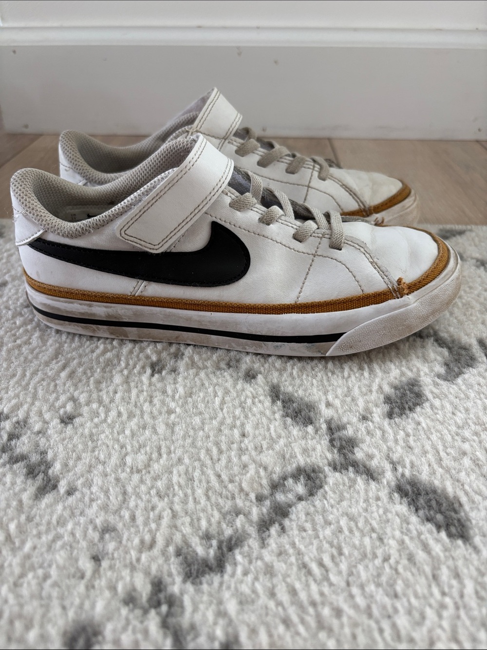 Nike Kids White Sneakers with Black Swoosh and Tan Trim